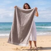 watermarked-img-1791801517394-1-Woman_holding_beach_towel_2K_20261012154735
