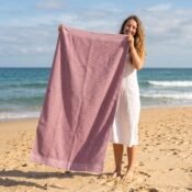 watermarked-img-1791801517394-28-Woman_holding_beach_towel_on_2K_20261011211343