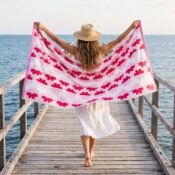 watermarked-img-1791801517394-15-Woman_walking_with_beach_towel_2K_20261012144133
