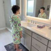 Boy_smiling_in_bathroom_mirror_2K_20261008232554.jpg