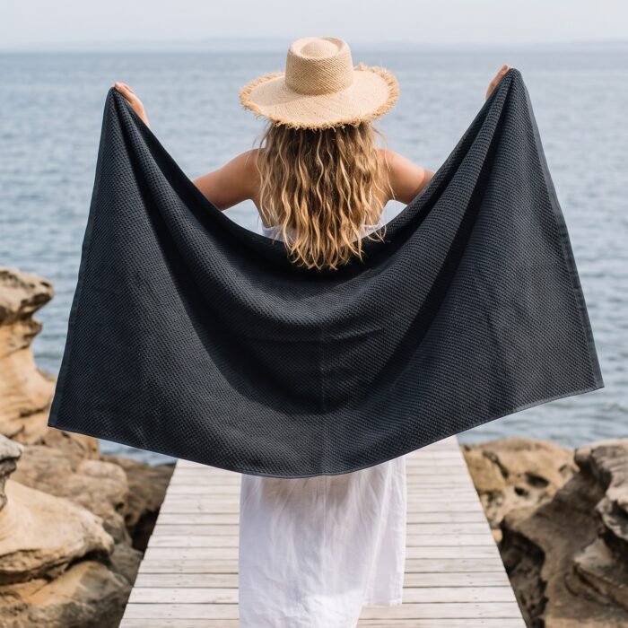 Woman_holding_towel_on_jetty_2K_20261011214939 Woman_holding_towel_on_jetty_2K_20261011214939