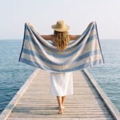 watermarked-img-1791801517394-14-Woman_holding_towel_on_jetty_2K_20261012144422