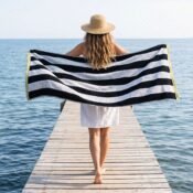 watermarked-img-1791801517394-19-Woman_holding_beach_towel_on_2K_20261012142634