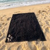 watermarked-img-1791801517394-3-Black_beach_towel_on_sand_2K_20261012153309