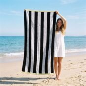 watermarked-img-1791801517394-5-Woman_holding_striped_beach_towel_2K_20261012152040